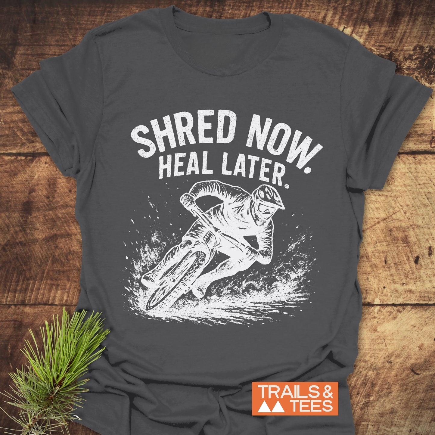 Shred Now Heal Later Mountainbike T-Shirt features a man biking graphic, crafted from soft cotton, designed for comfort and durability, perfect for outdoor enthusiasts.
