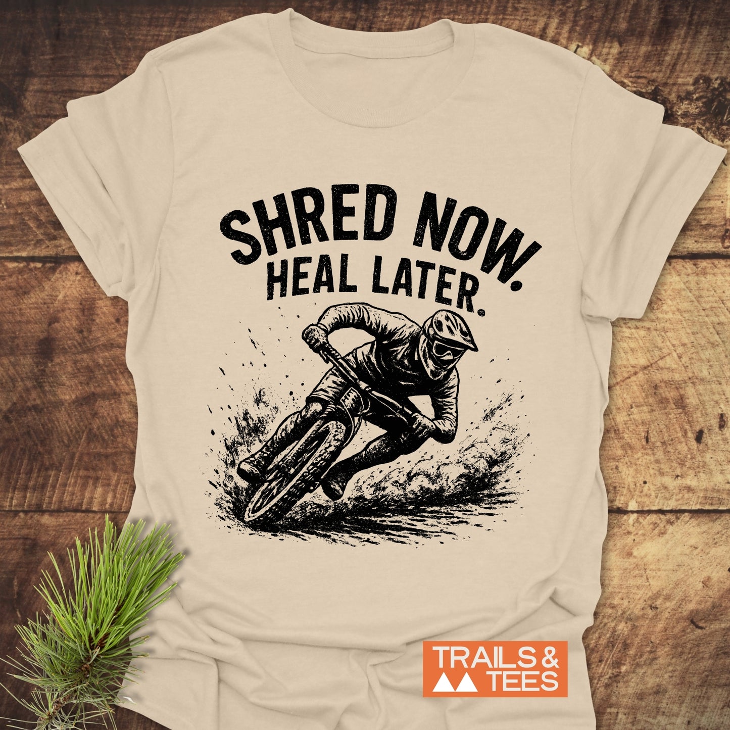 Shred Now Heal Later Mountainbike T-Shirt featuring a man riding a bike, crafted from lightweight cotton for comfort and adventure-ready durability.