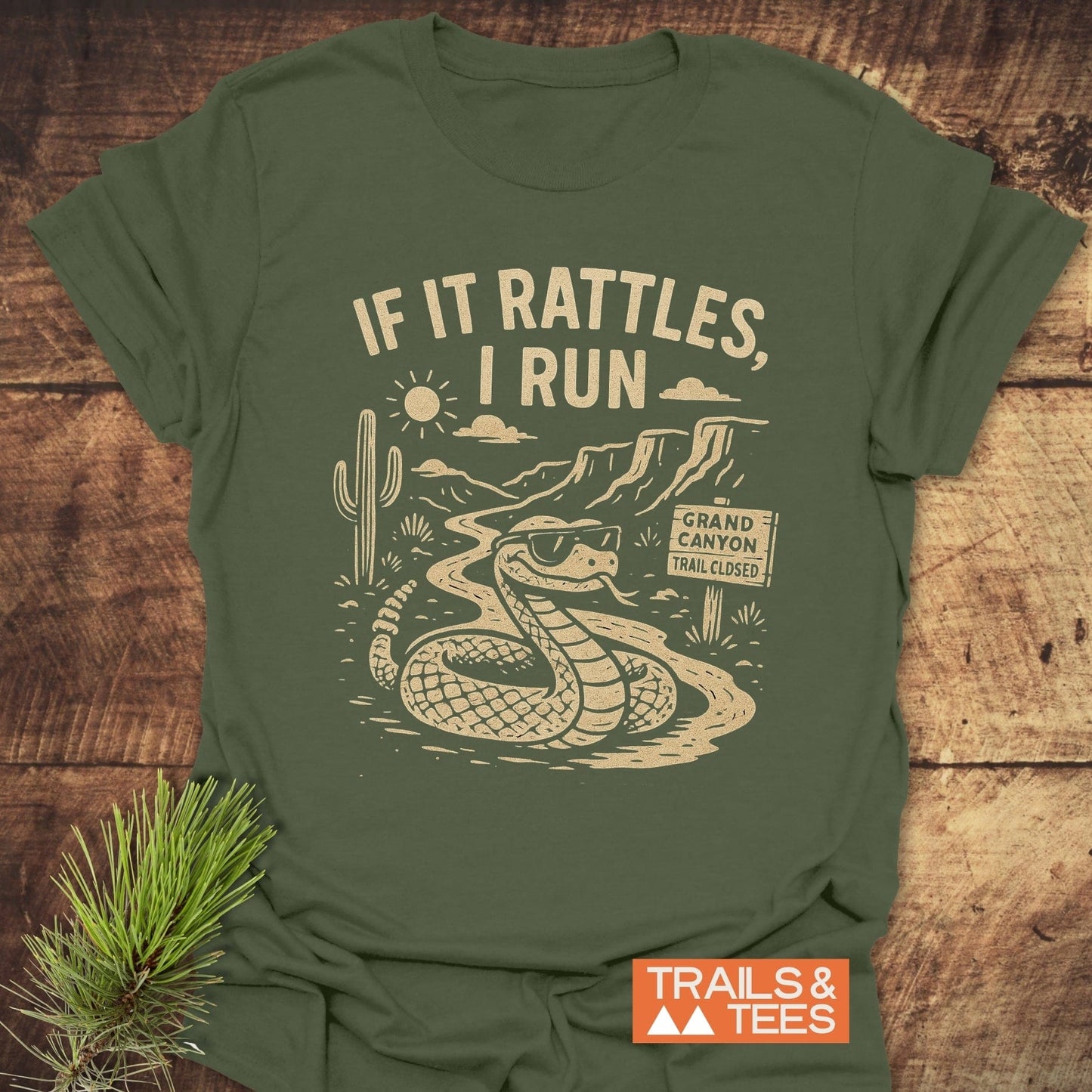 If It Rattles Funny T-Shirt with white text, designed for outdoor lovers, featuring a durable graphic print on soft, lightweight ring-spun cotton.