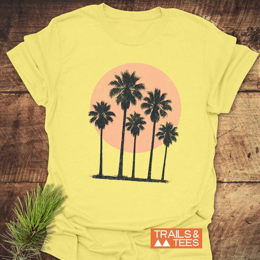 Palm Trees At Sunset T-Shirt featuring palm tree prints, crafted from soft cotton, ideal for outdoor adventures with durable, pre-shrunk fabric and taped shoulders.
