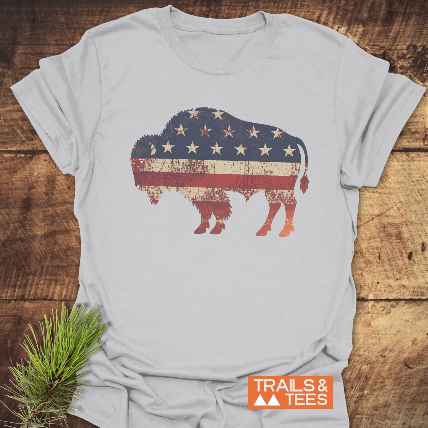 Land Of The Free Bison T-Shirt featuring a durable flag design, crafted from soft ring-spun cotton for comfort and adventure, with pre-shrunk reliability.
