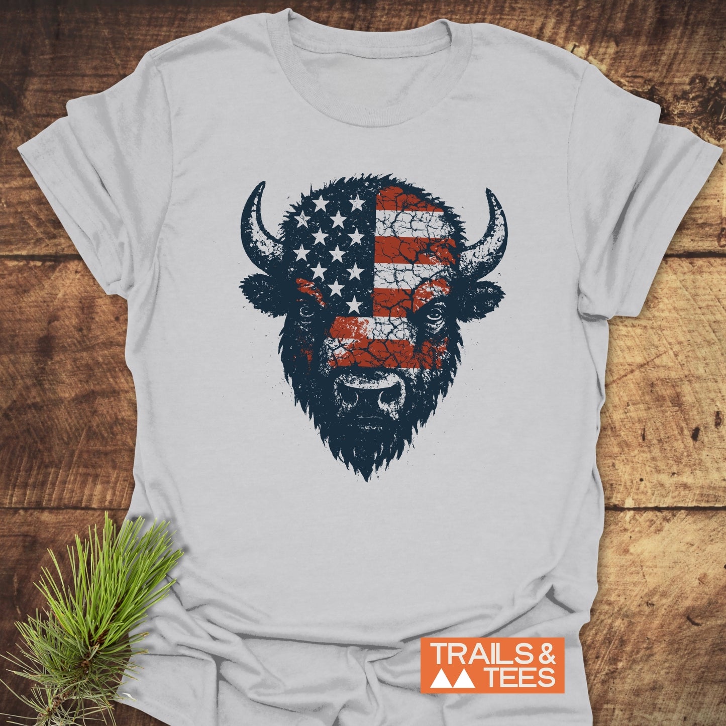 American Bison T-Shirt featuring a buffalo head with a flag design, crafted from soft cotton, offering durable prints and a comfortable fit for outdoor adventures.