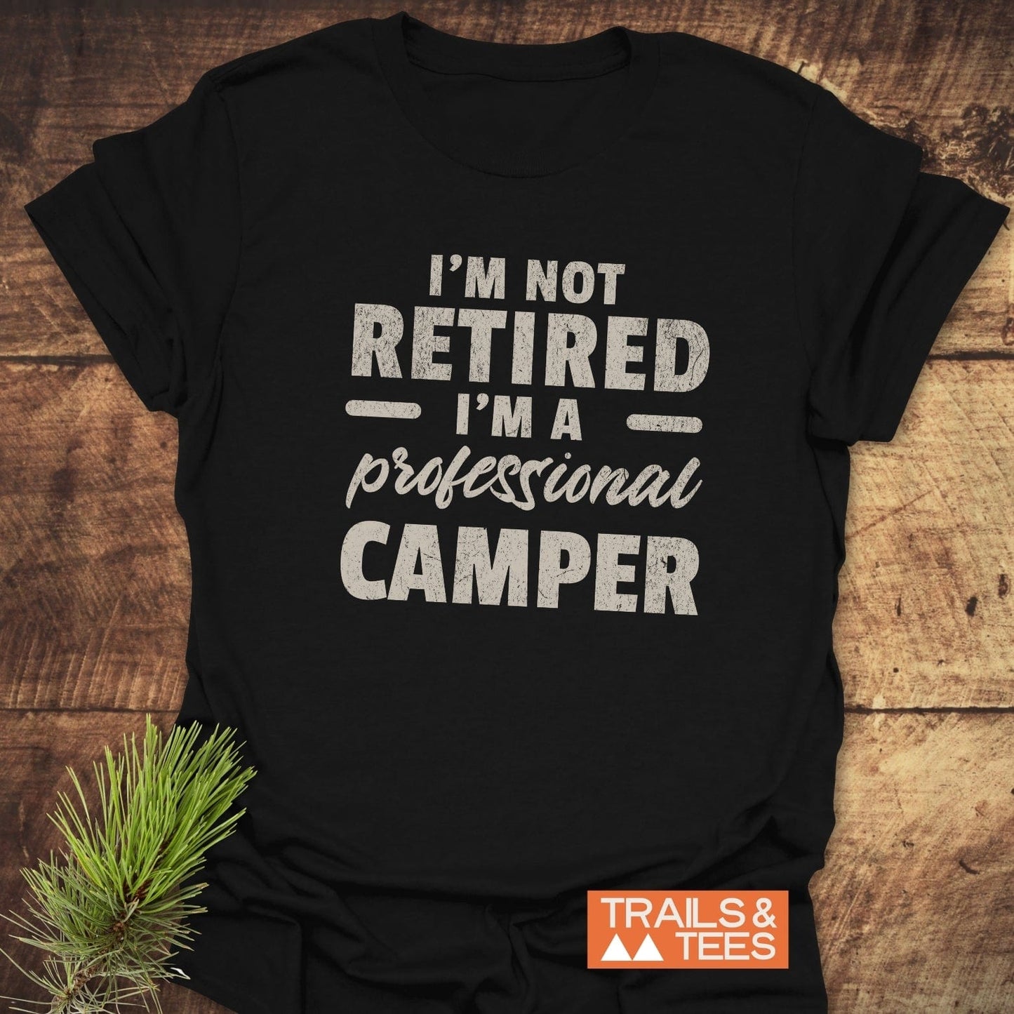 Not Retired T-Shirt: Black shirt with bold white text, crafted from soft ring-spun cotton, designed for comfort and durability during outdoor adventures.
