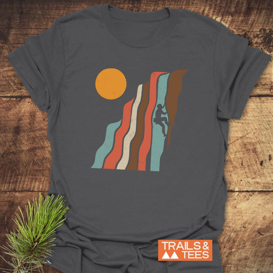 Retro Climber T-Shirt with rock climber silhouette on striated cliff design, crafted from soft cotton, offering durable prints and pre-shrunk fit for everyday adventure.