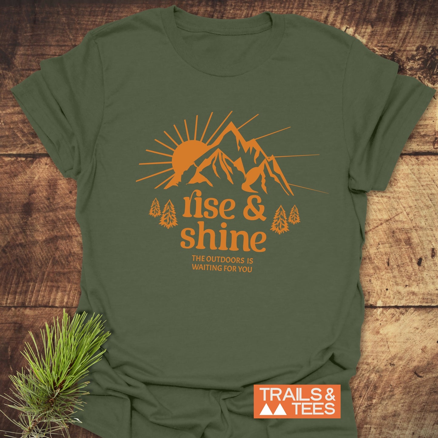 Rise And Shine T-Shirt featuring a sunrise and mountain graphic, crafted from soft, ring-spun cotton, ideal for outdoor enthusiasts.