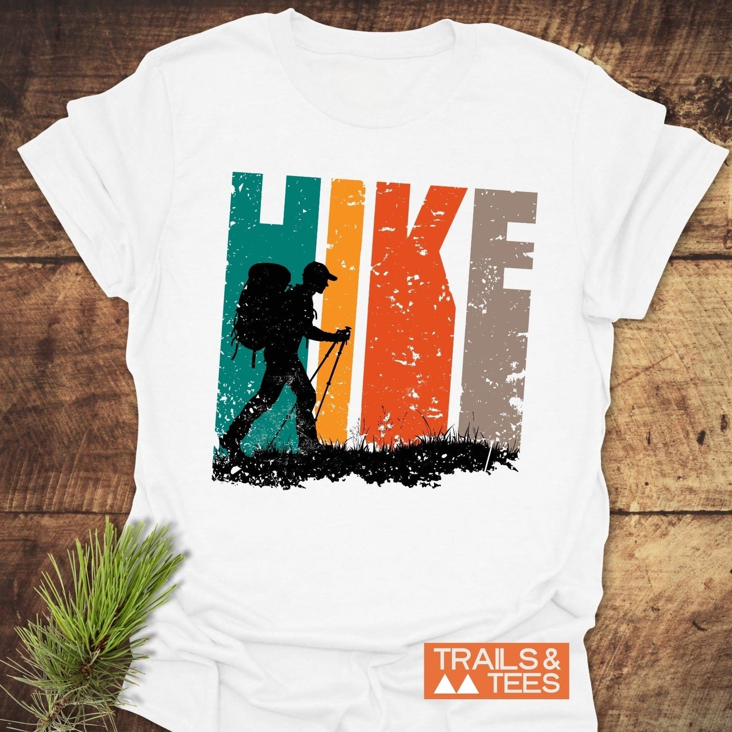 HIKE Retro Sunset T-Shirt with a distressed graphic of a hiker silhouette. Made from soft cotton for comfort, featuring durable prints, ideal for outdoor enthusiasts.