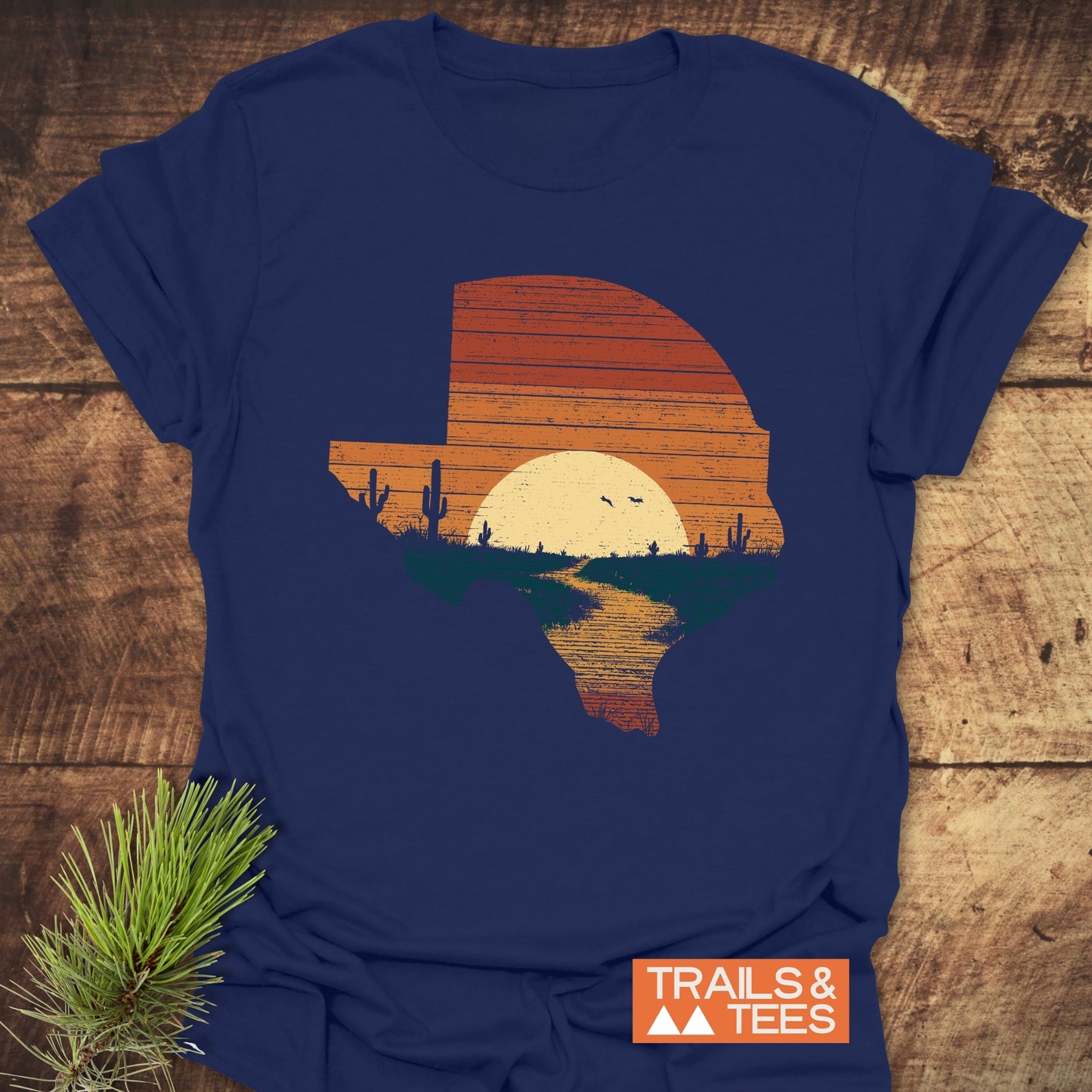 Texas Sunset T-Shirt features a distressed Texas graphic with a desert sunset scene on soft, lightweight cotton, perfect for outdoor adventures.