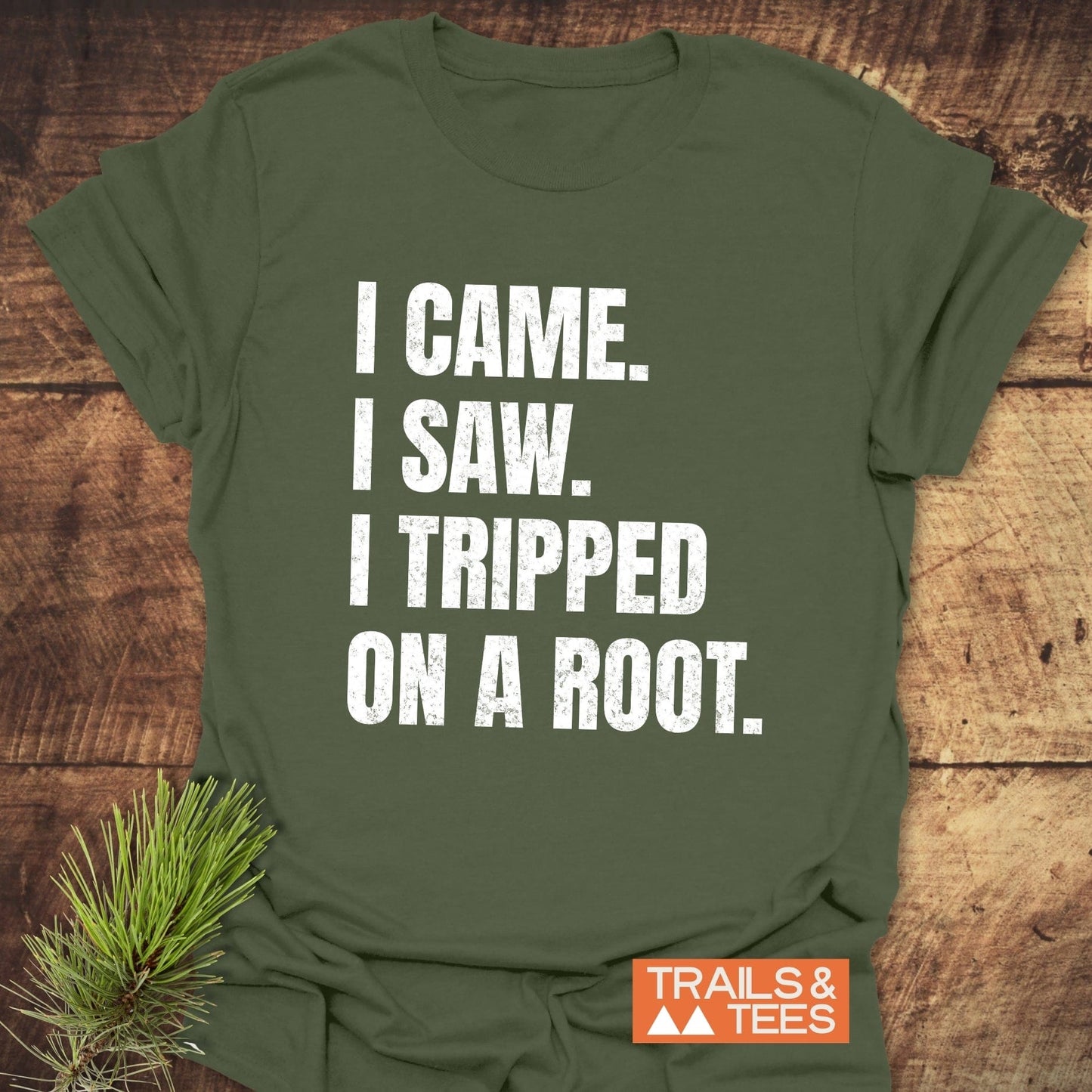 Olive-green I Came. I Saw. I Tripped... T-shirt with a humorous slogan, made from soft cotton, featuring a distressed white print and Trails & Tees logo.