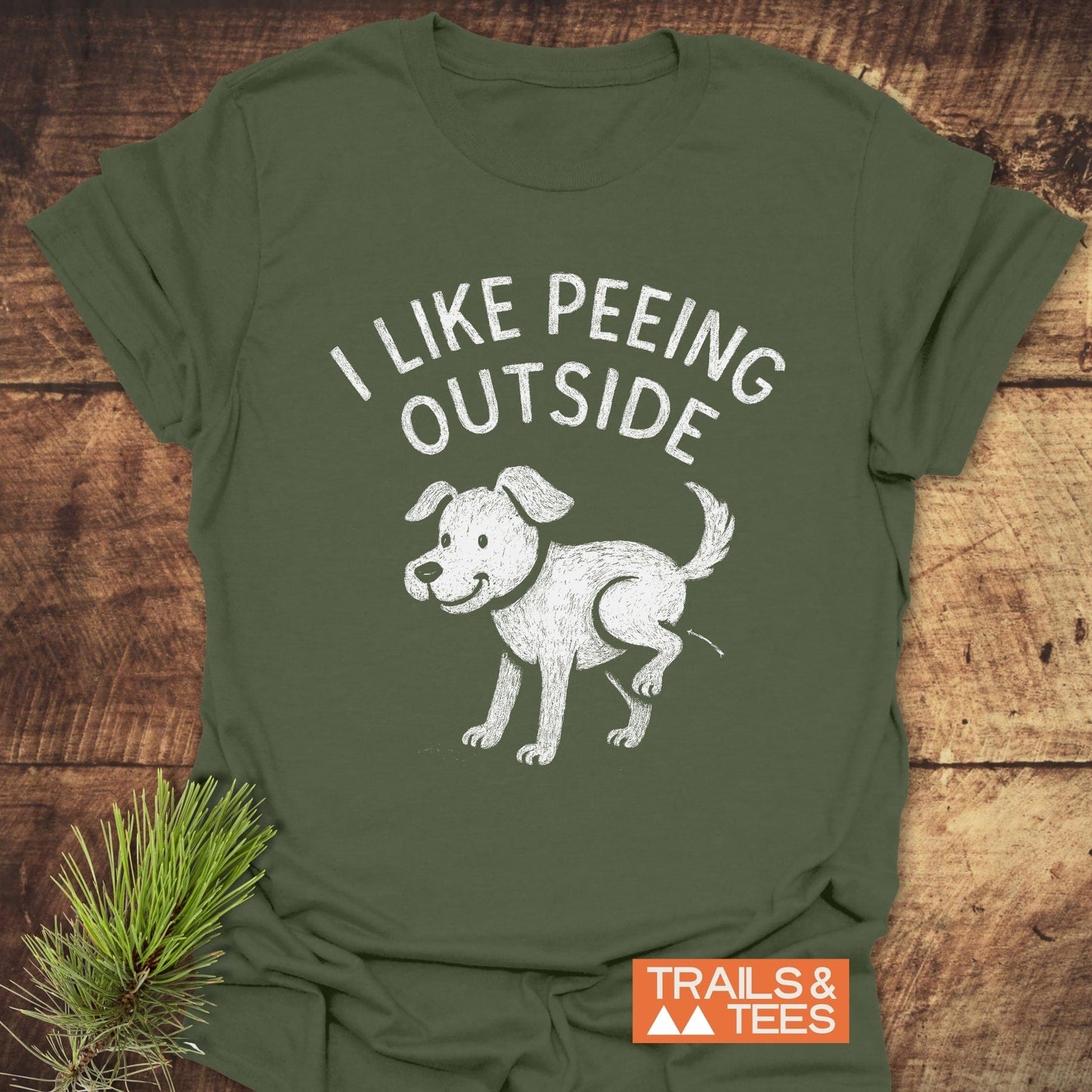 I Like Peeing Outside T-Shirt featuring a chalk-style dog illustration. Made from soft ring-spun cotton, it offers durability and comfort for outdoor adventures.