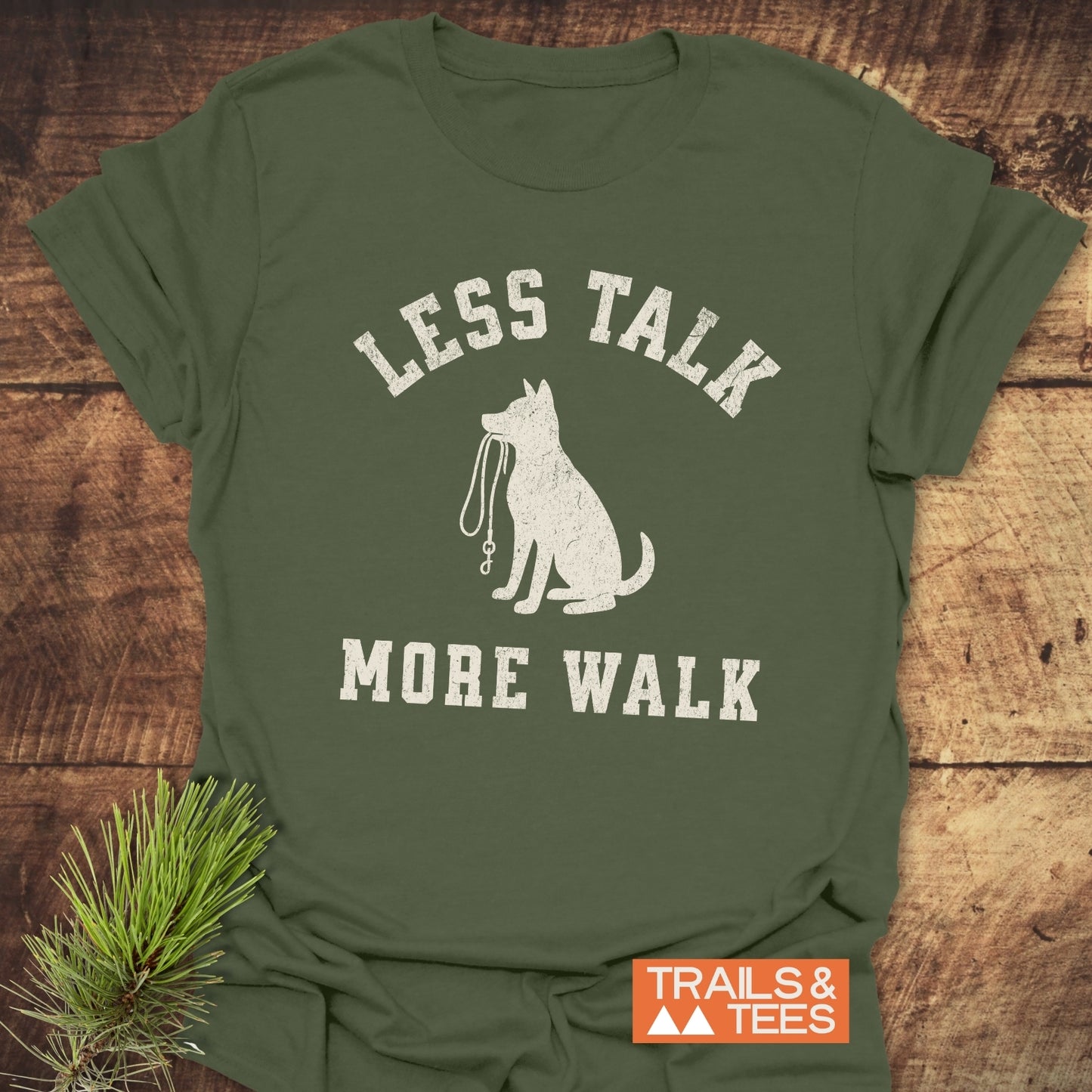 Less Talk, More Walk T-Shirt featuring a dog graphic and slogan, made from soft ring-spun cotton, designed for outdoor enthusiasts, with durable prints and pre-shrunk fit.