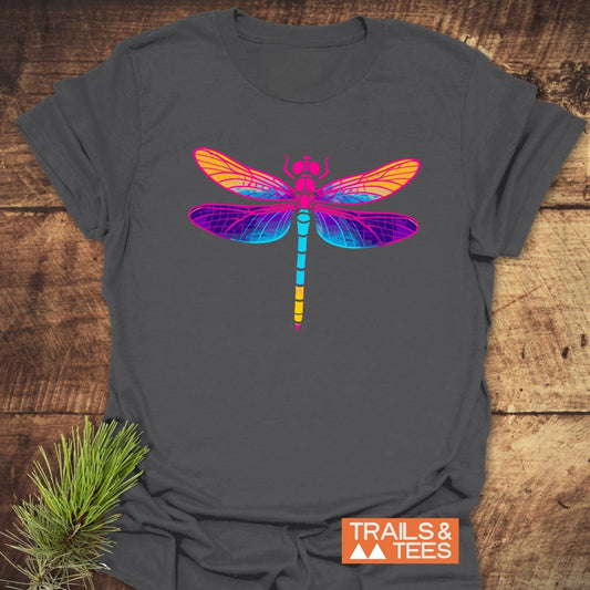 Psychedelic Dragonfly T-Shirt featuring a vibrant dragonfly design on charcoal-gray fabric, showcasing comfort and durability with a “TRAILS & TEES” logo.