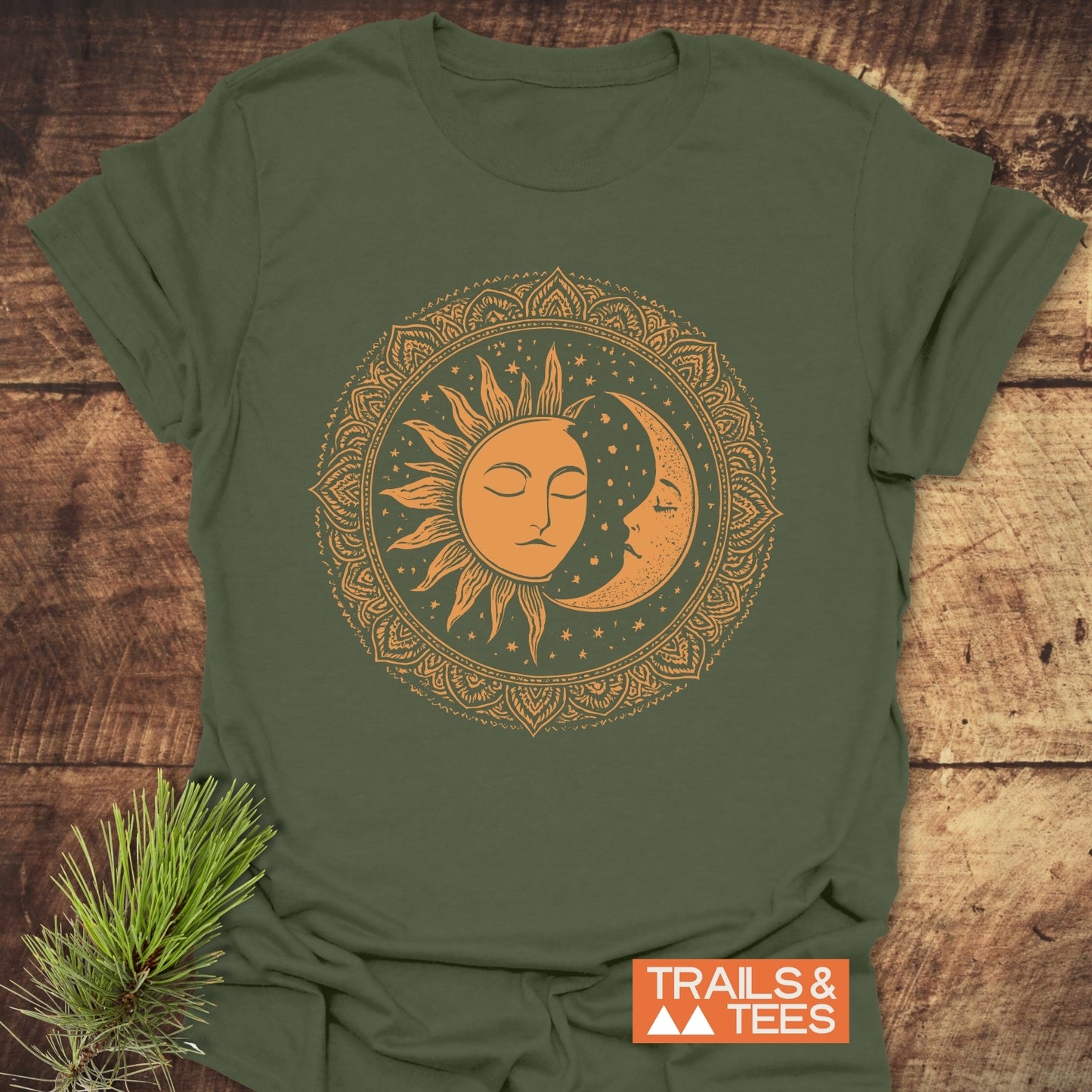 Bohemian Sun And Moon T-Shirt featuring a mandala sun-moon graphic, laid flat with a TRAILS & TEES tag, embodying trail-tested comfort and timeless design.