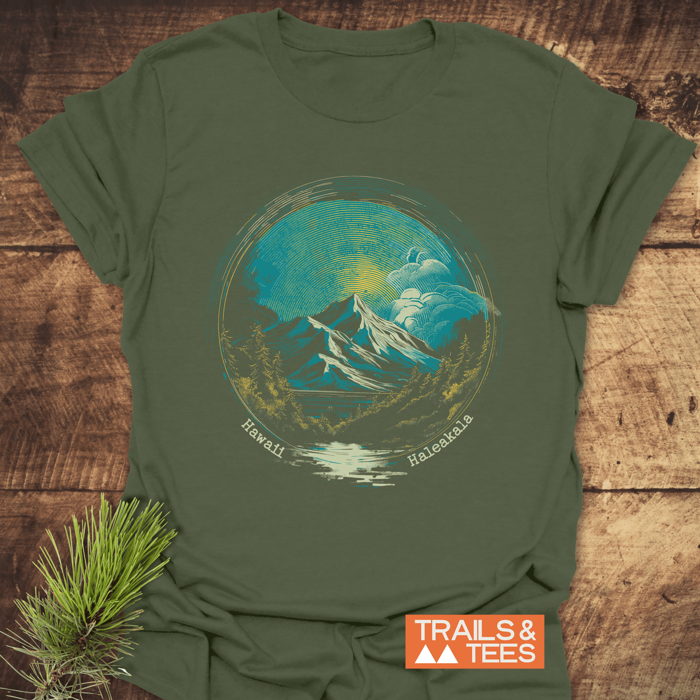 Hawaii Haleakala T-Shirt featuring a hand-drawn landscape with mountains and trees, crafted from soft cotton for comfort and durability, with TRAILS & TEES logo.