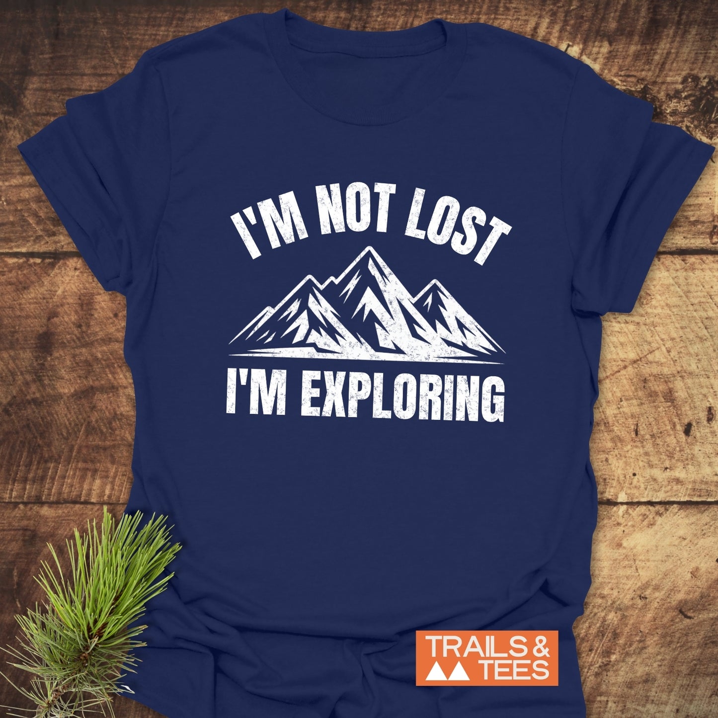 Navy blue I'm Not Lost I'm Exploring T-shirt with mountain graphic, crafted from soft cotton, featuring durable print, ideal for outdoor enthusiasts.