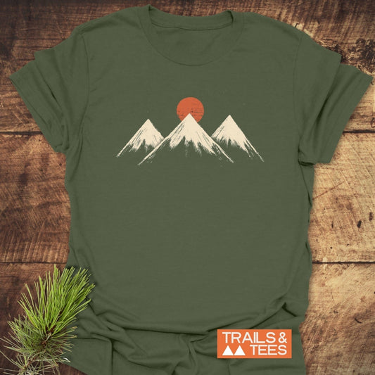 Three Mountains And Sun T-Shirt with minimalist mountain graphic, crafted from soft ring-spun cotton, ensuring comfort and durability. Features TRAILS & TEES logo.