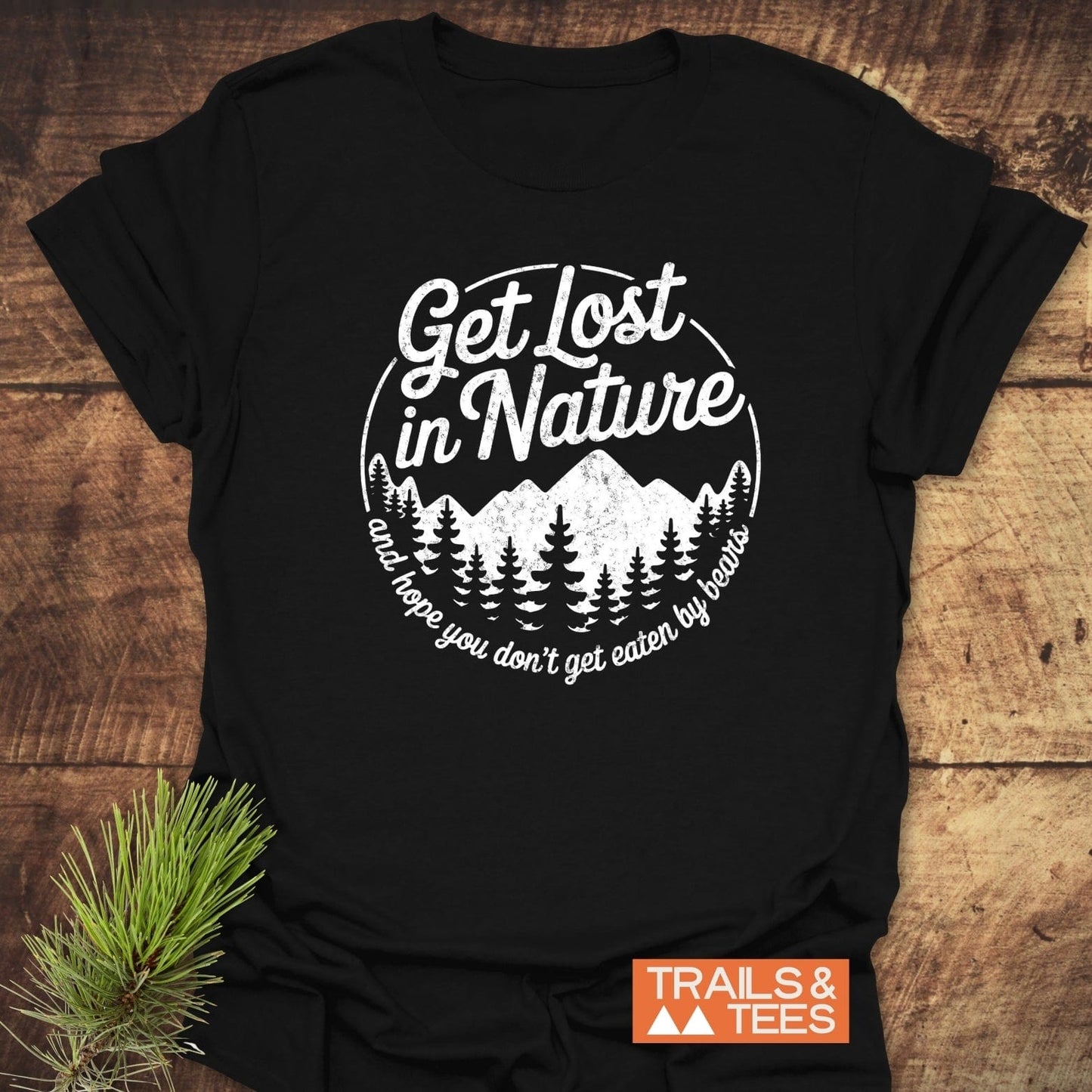 Get Lost In Nature Bear T-Shirt with mountain and pine graphic on black cotton, featuring comfort design details for outdoor enthusiasts.