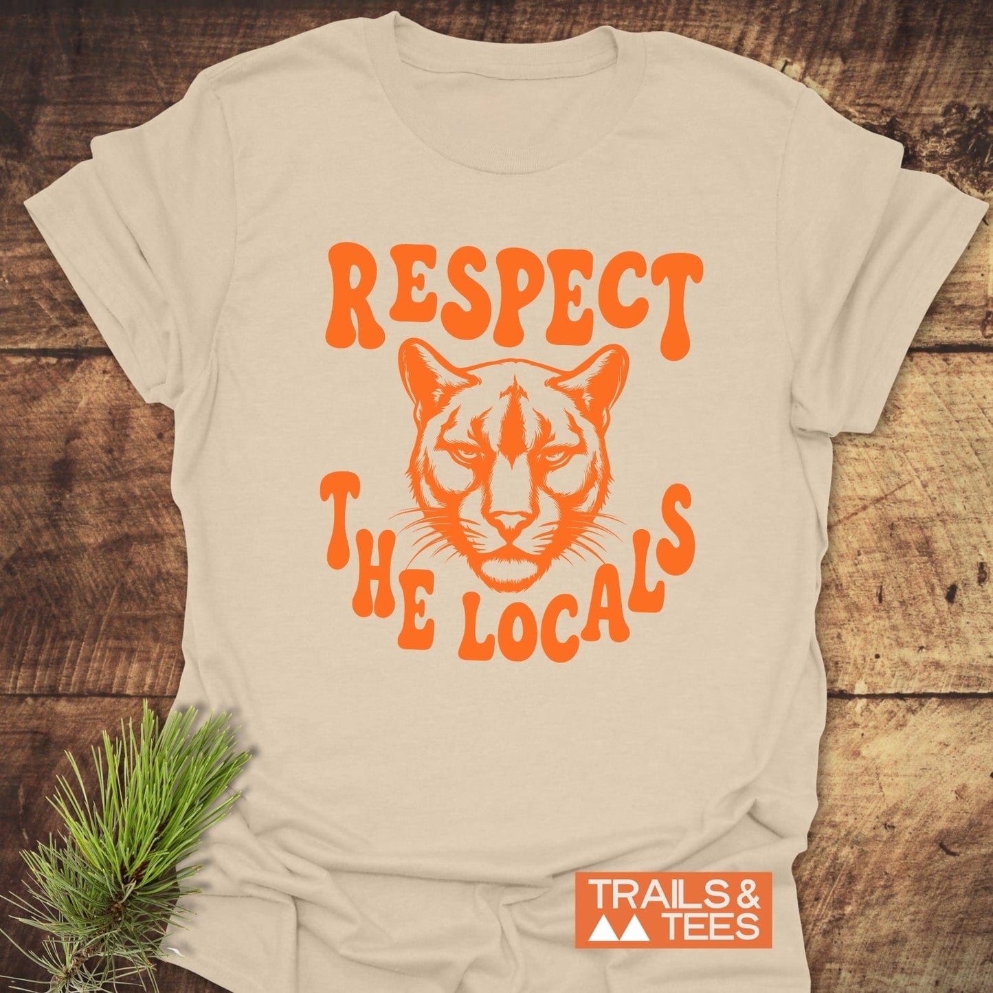 Respect The Locals, Cougar T-Shirt features a mountain lion design. Soft ring-spun cotton, pre-shrunk for fit, with durable prints, ideal for outdoor enthusiasts.