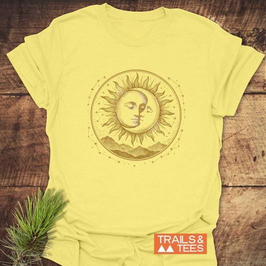 Celestial Embrace T-Shirt with sun, moon, stars graphic on soft cotton, showcasing outdoor-inspired design by TRAILS & TEES. Ideal for adventure and comfort.