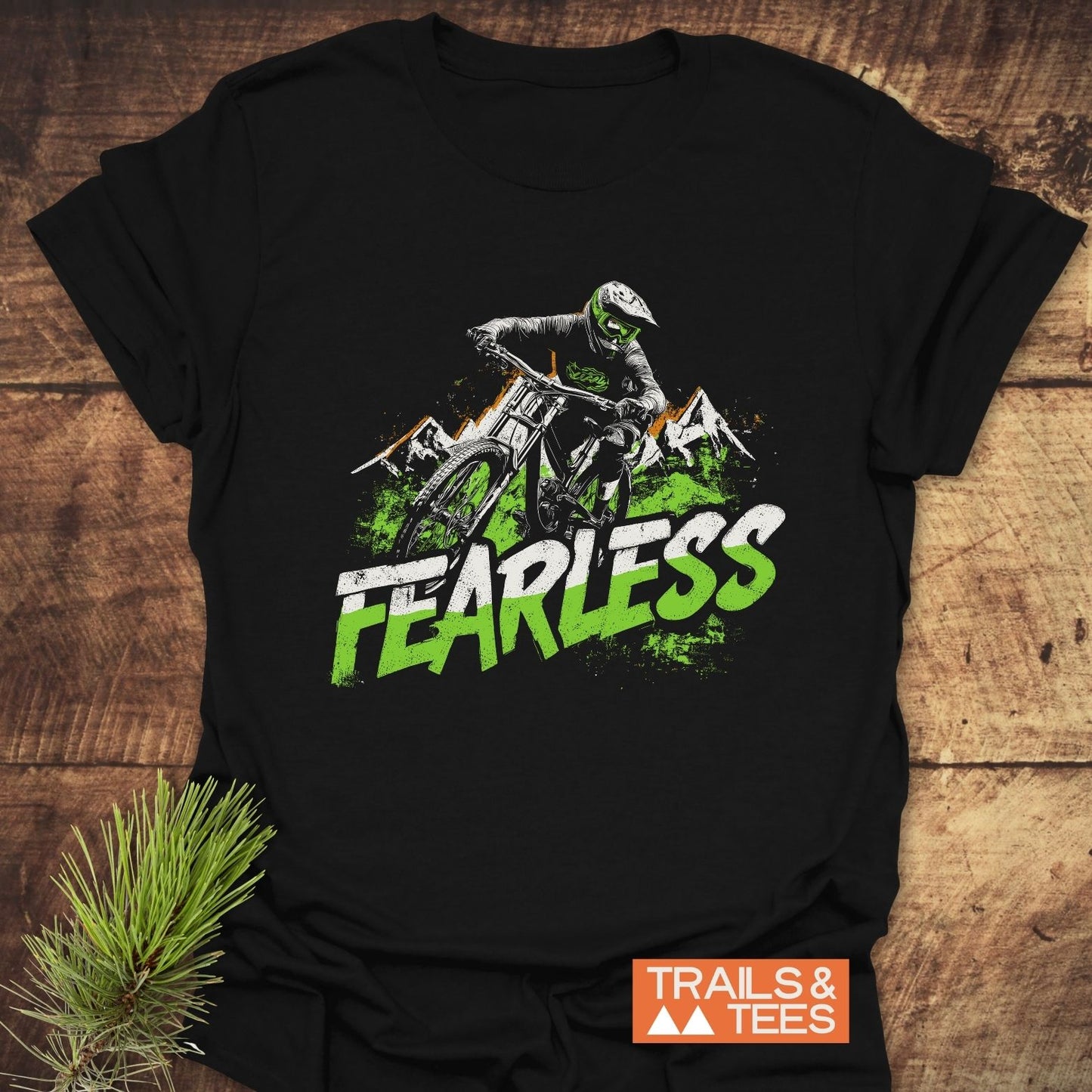Fearless Mountainbiker T-Shirt: Black tee with green-white biker graphic, FEARLESS text. Lightweight, durable cotton for outdoor adventures. Eco-friendly, USA-made.