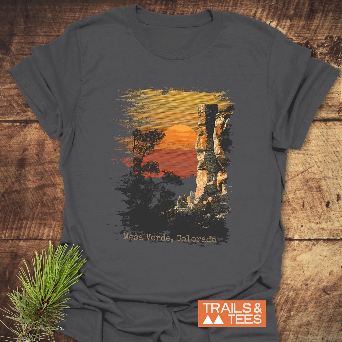 Mesa Verde, Colorado T-Shirt featuring a sunset scene with trees and rock formation, crafted from soft ring-spun cotton for comfort and durability.