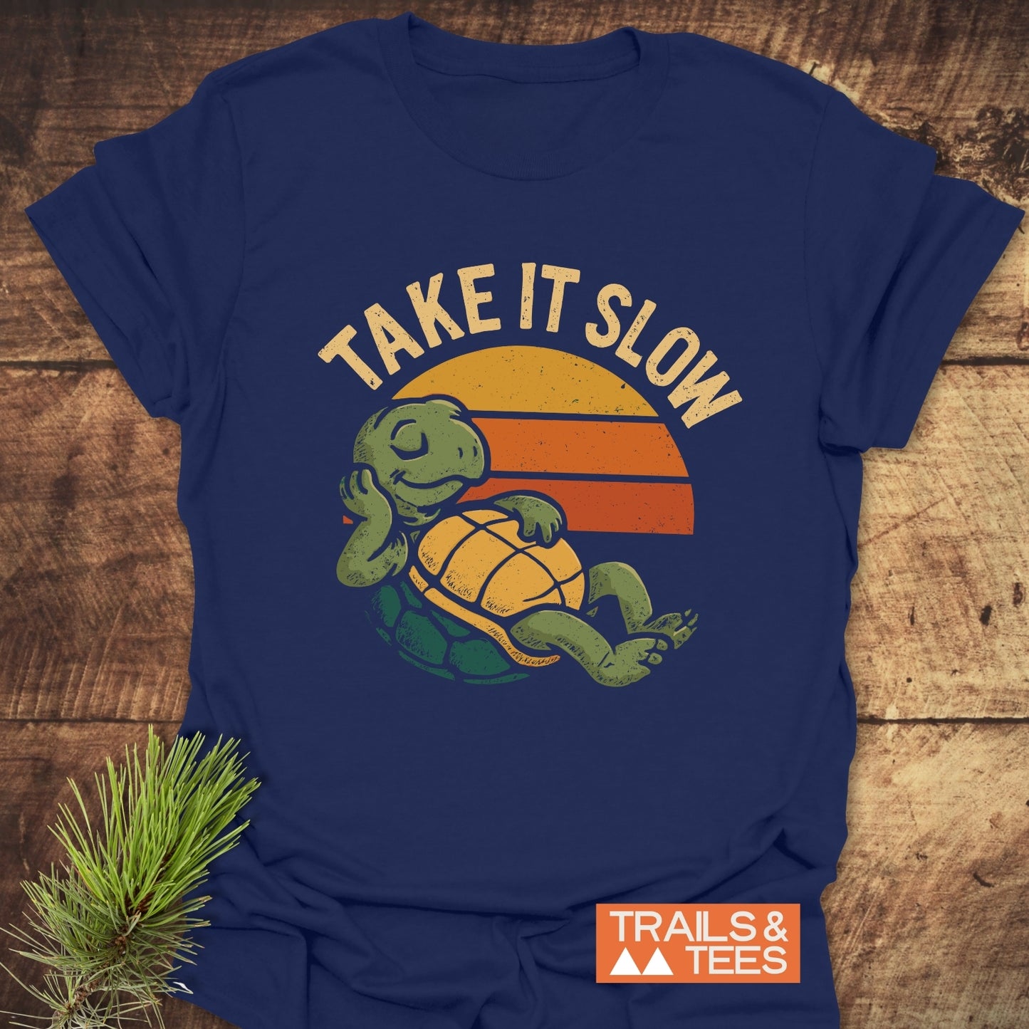 Take It Slow Turtle T-Shirt featuring a retro turtle graphic and TAKE IT SLOW slogan, designed for comfort with durable print and pre-shrunk fit.