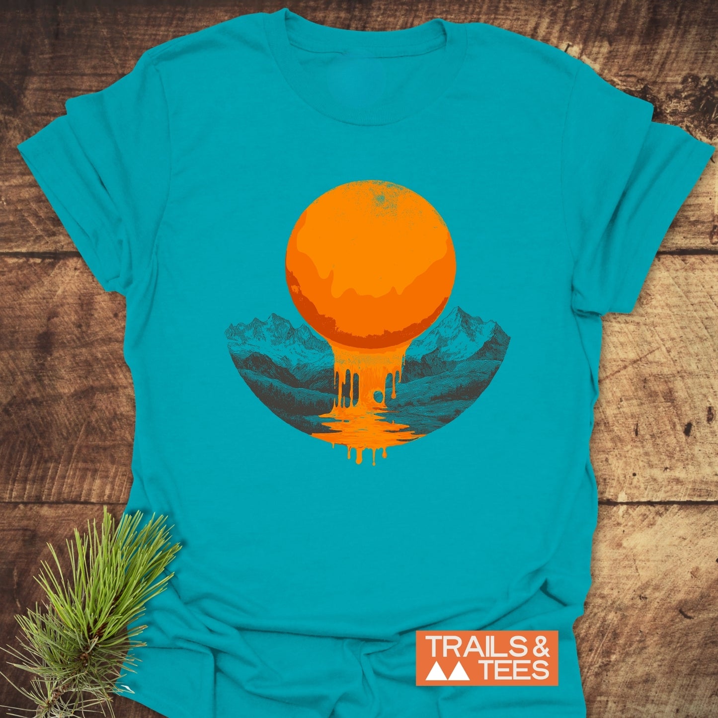 Melting Sun T-Shirt featuring a dripping sun graphic over mountains and lake, crafted from lightweight ring-spun cotton with durable print and logo.
