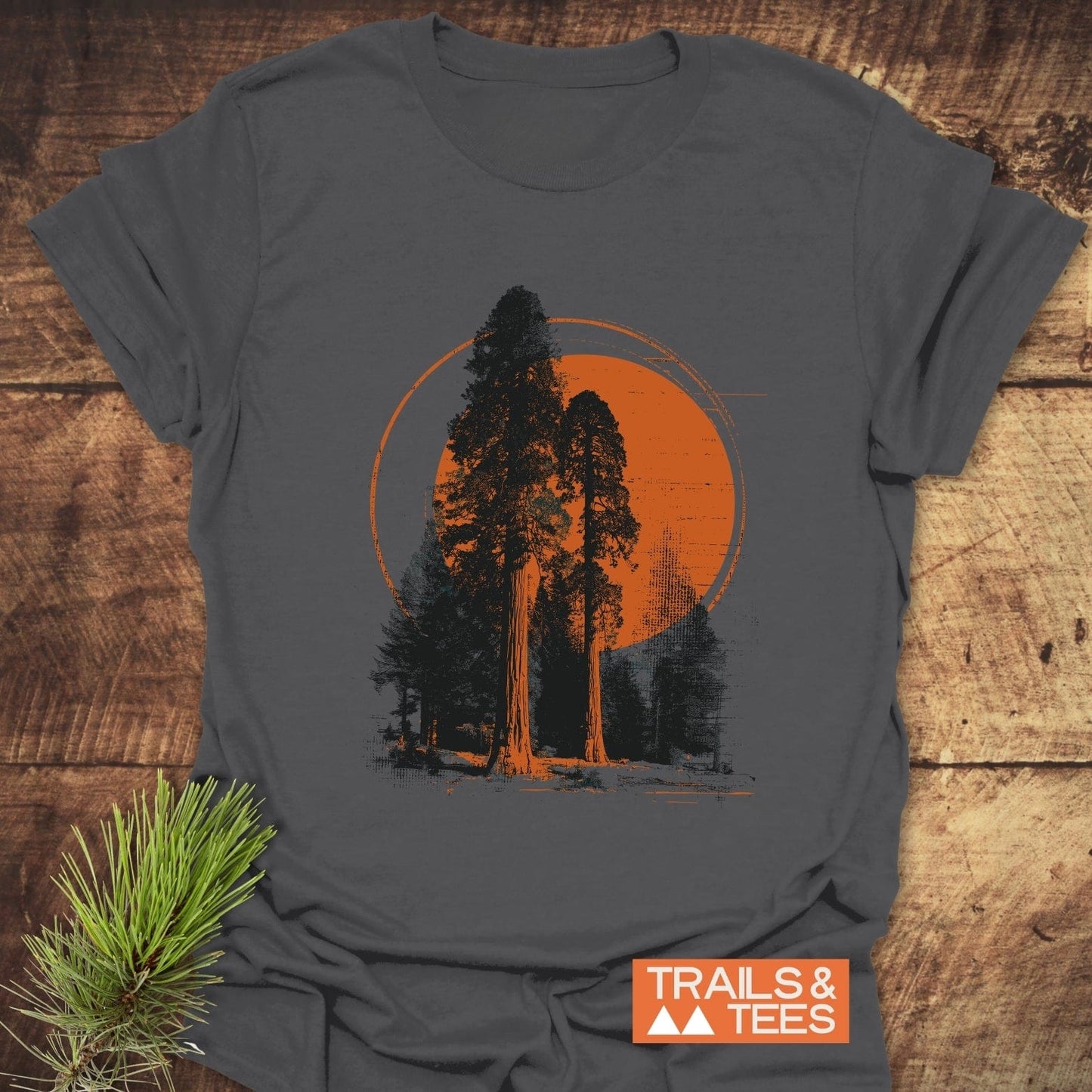 Sequoia T-Shirt with towering tree graphic on a charcoal-gray background, featuring Trails & Tees logo; soft ring-spun cotton, pre-shrunk, durable print.