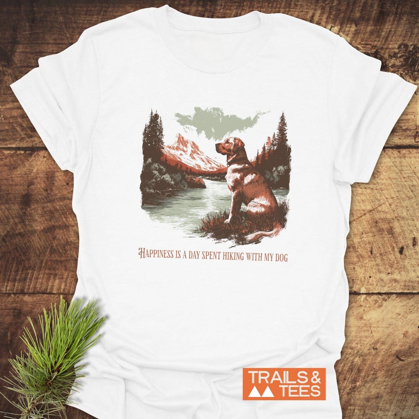 Happiness Is Hiking With Dogs T-Shirt featuring a mountain lake scene with a dog, crafted from soft cotton, emphasizing comfort and outdoor adventure.
