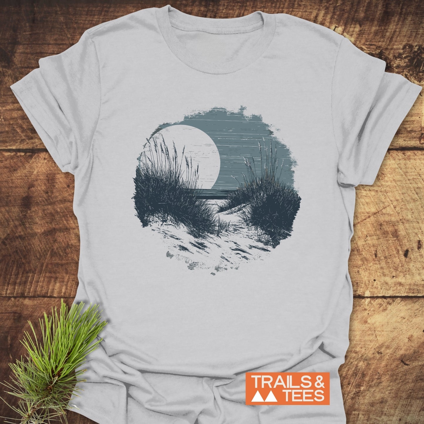 Indiana Dunes National Park T-Shirt featuring a sandy path graphic, crafted from soft ring-spun cotton, styled with a pine sprig, perfect for outdoor enthusiasts.