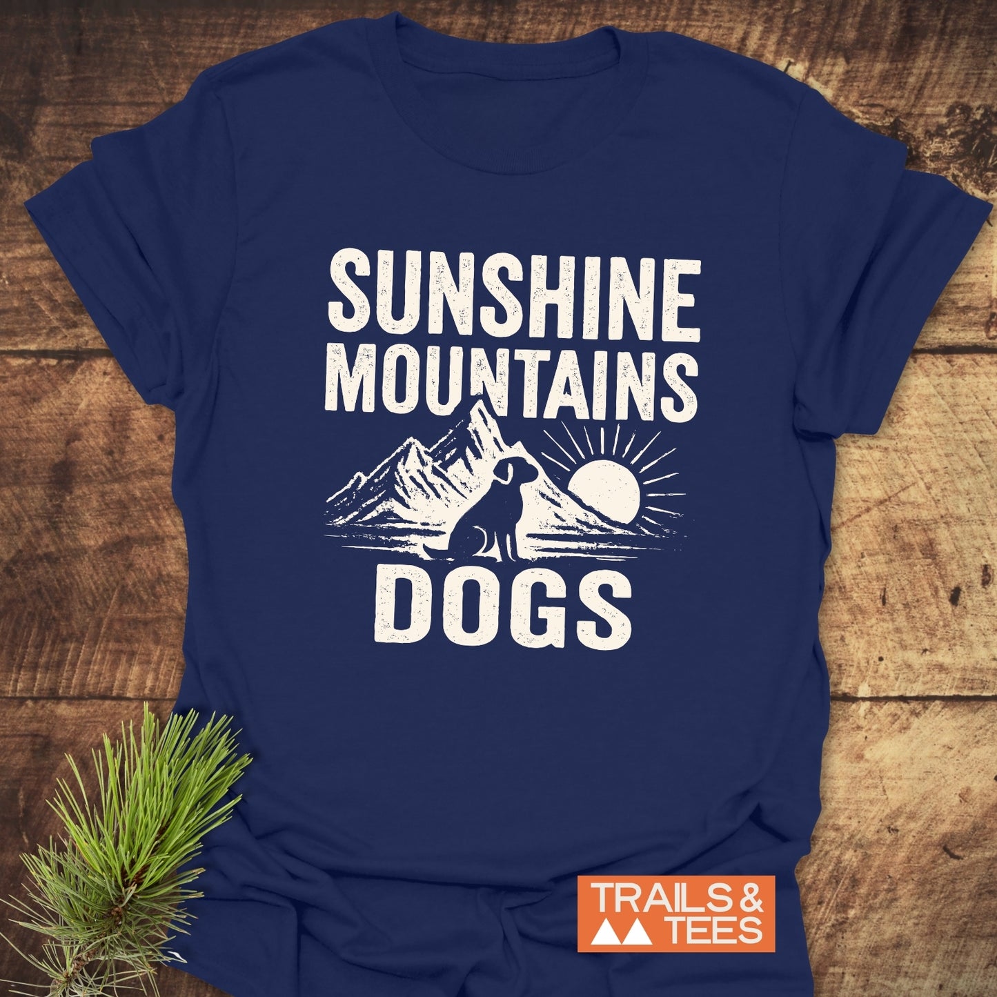 Sunshine Mountains Dogs T-Shirt: Navy-blue tee with white distressed graphic of mountains, sun, and dog. Soft ring-spun cotton, durable print, pre-shrunk, no side seams.