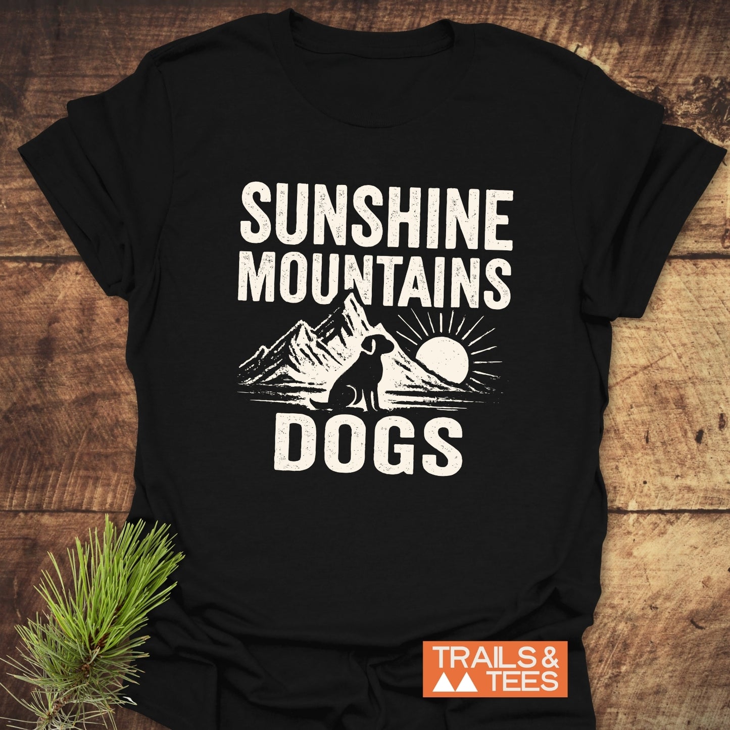 Sunshine Mountains Dogs T-Shirt features distressed lettering and a dog silhouette with mountains. Made from soft cotton, designed for adventure and durability.