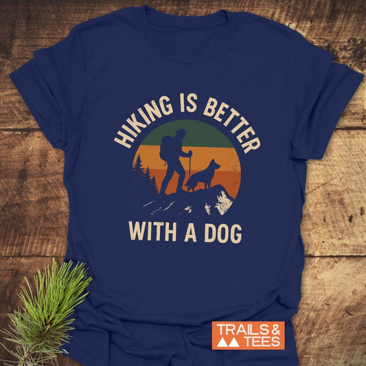 Navy-blue Hiking Is Better With A Dog T-Shirt featuring retro graphic of hiker and dog, crafted from soft cotton, with durable print and comfort-focused design.