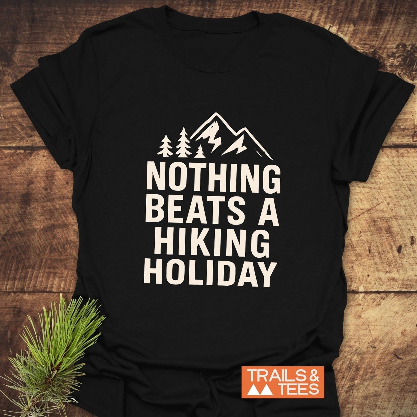 Nothing Beats A Hiking Holiday T-Shirt with mountain graphic and slogan, crafted from soft cotton, perfect for outdoor enthusiasts. Features durable print and taped shoulders.