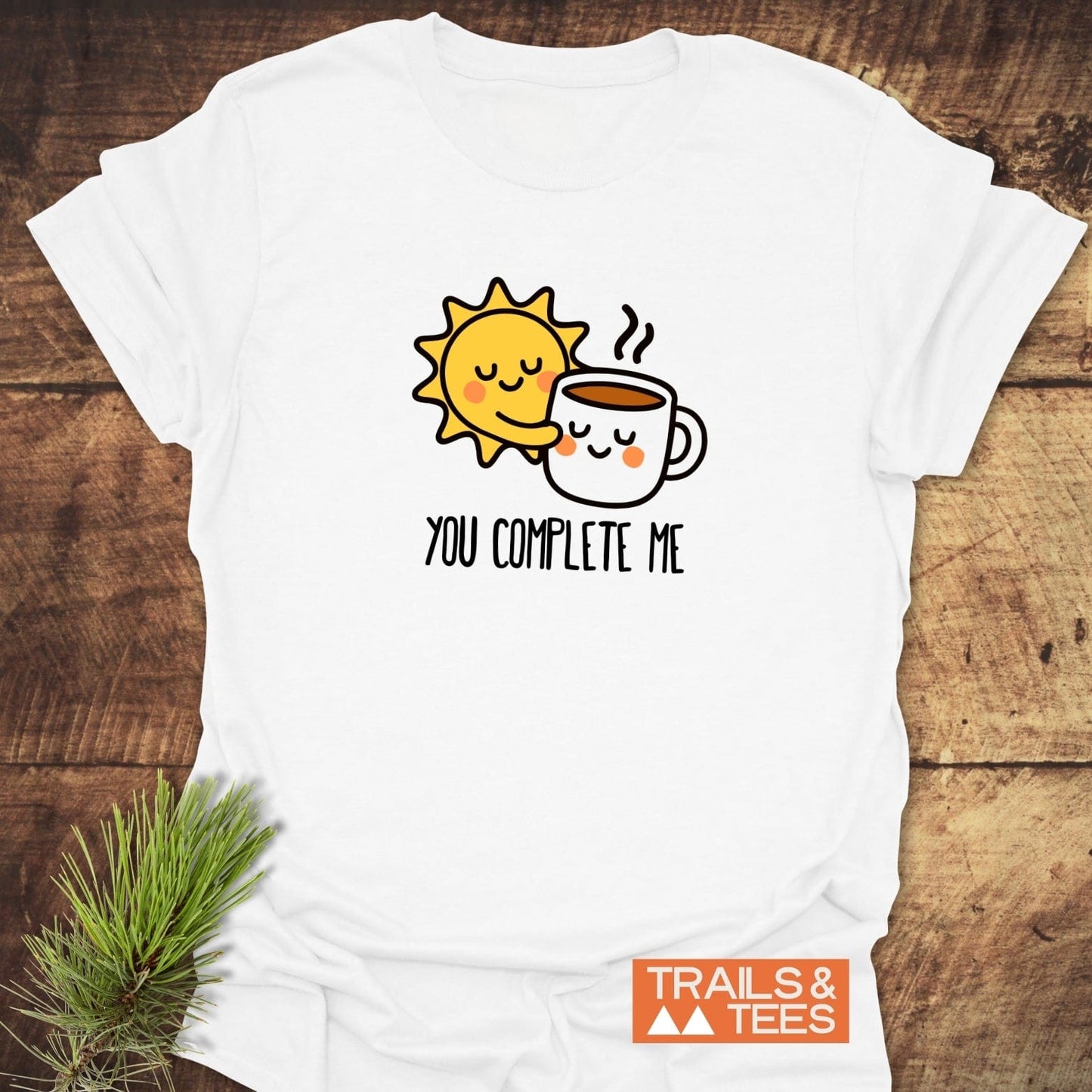 You Complete Me - Sun & Coffee T-Shirt featuring a cartoon sun hugging a coffee mug, printed on soft, durable cotton, perfect for outdoor adventures.