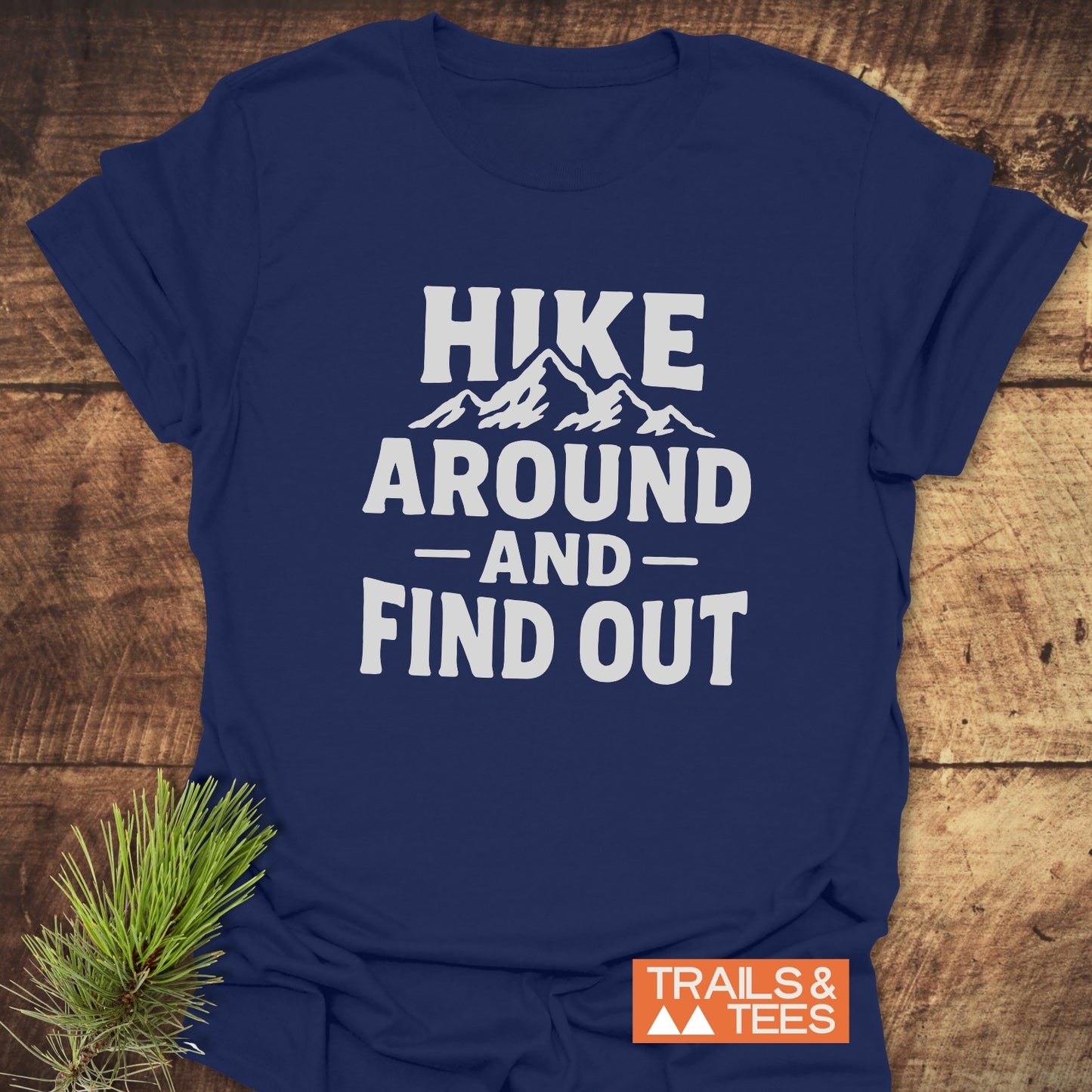 Navy Hike Around And Find Out T-Shirt with mountain graphic, crafted from soft cotton for outdoor comfort, featuring durable prints and Trails & Tees branding.