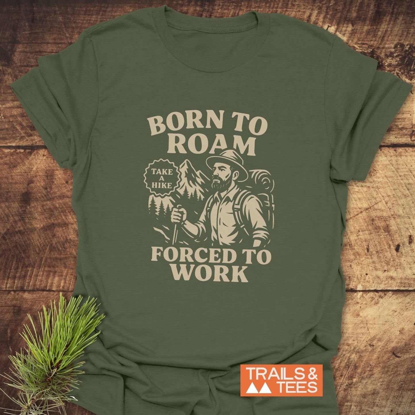 Born To Roam T-Shirt featuring a bearded hiker graphic with TAKE A HIKE badge on soft, lightweight cotton. Ideal for outdoor enthusiasts and everyday comfort.