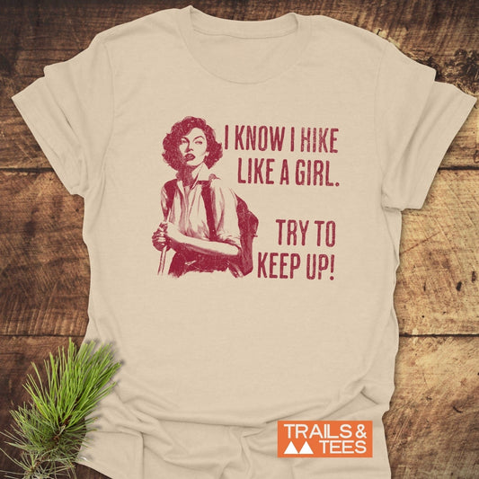 Hike Like A Girl T-Shirt featuring a retro hiker print on soft cotton, emphasizing outdoor adventures with durable, fade-resistant design by Trails & Tees.