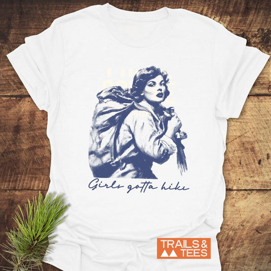 Girls Gotta Hike T-Shirt featuring a vintage-style woman illustration and slogan, showcasing trail-ready comfort and durable design for outdoor enthusiasts.