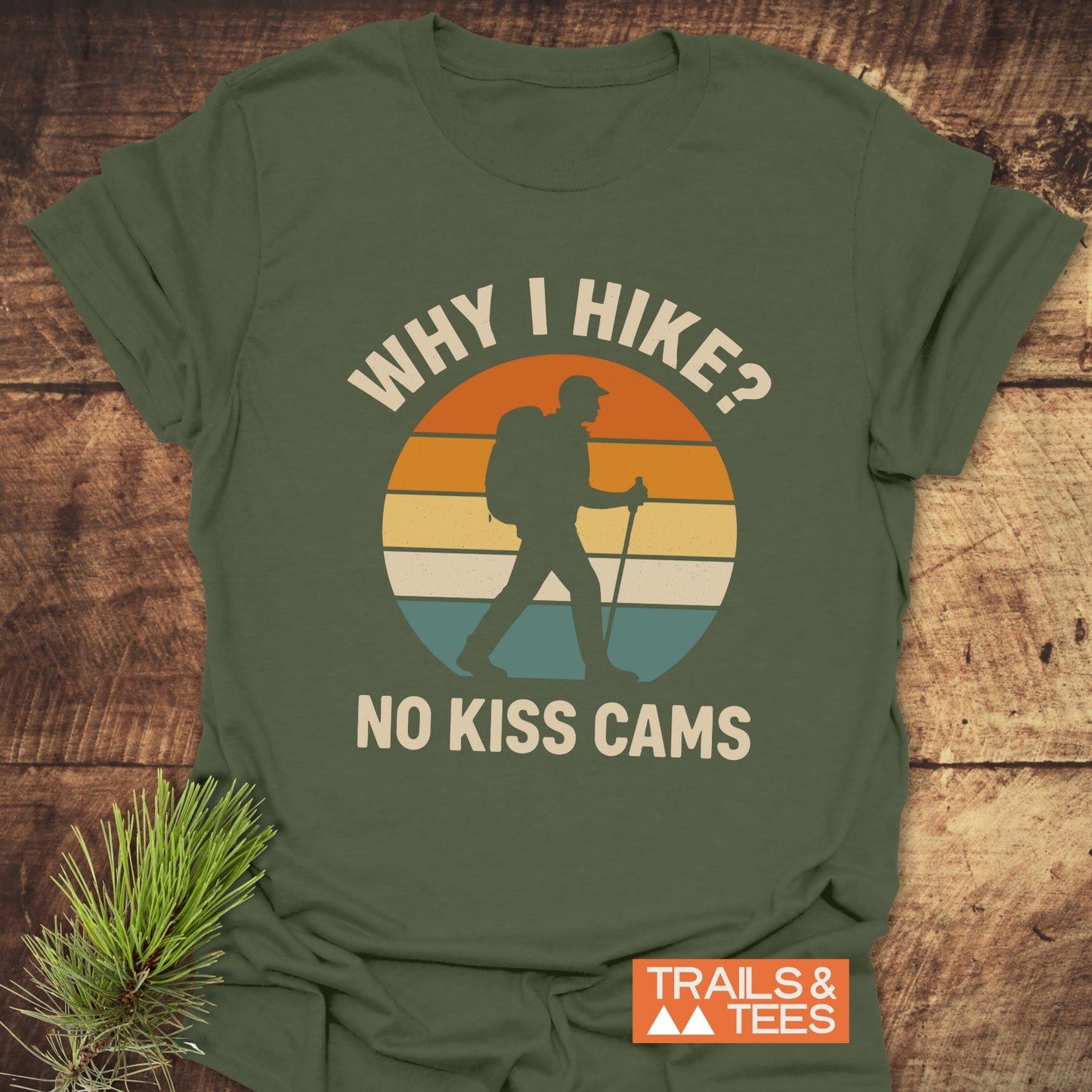 Why I Hike? No Kiss Cams T-Shirt featuring a retro sunset graphic with a hiker silhouette, crafted from soft ring-spun cotton for comfort and durability.