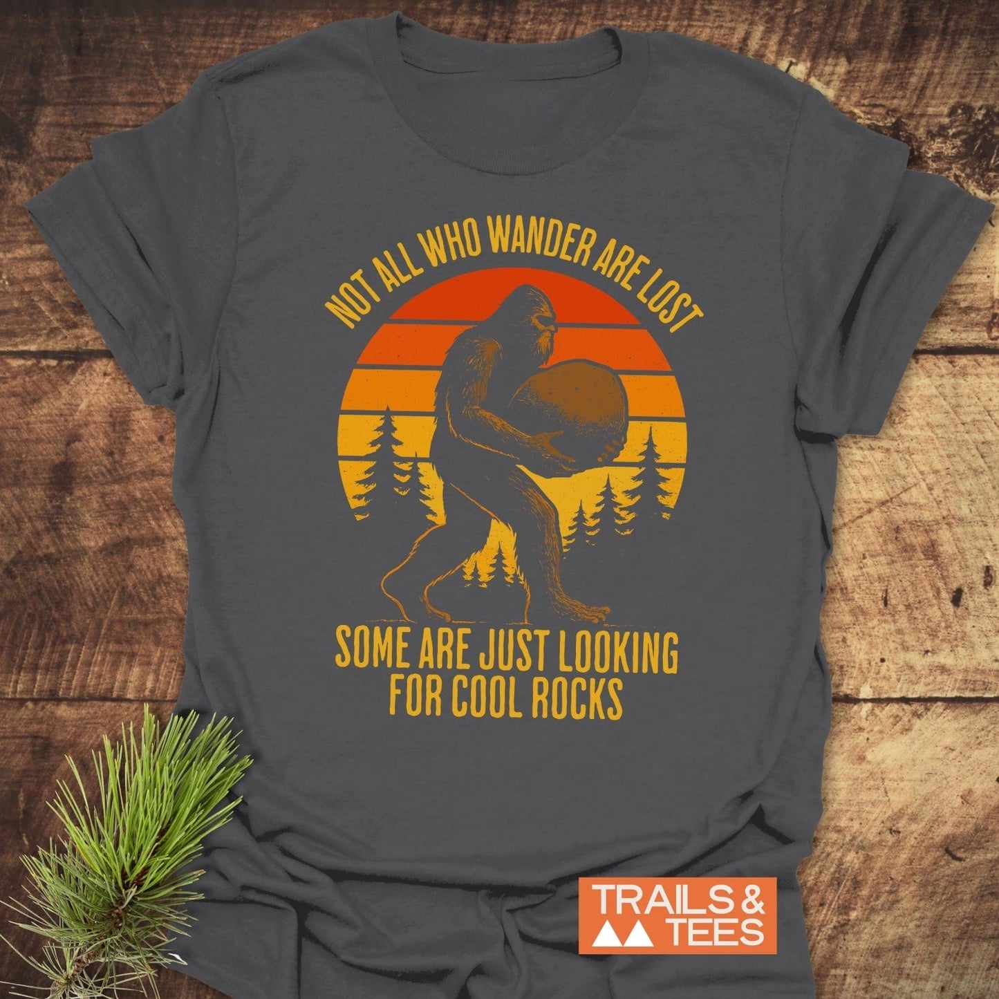 Looking For Cool Rocks T-Shirt featuring Bigfoot with sunset graphic, crafted from soft ring-spun cotton. Ideal for outdoor adventures, pre-shrunk, durable print, no side seams.