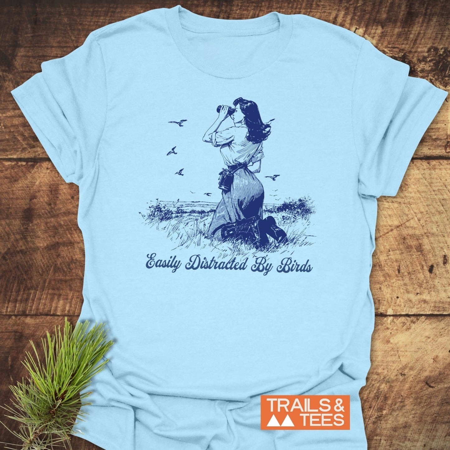 Easily Distracted By Birds T-Shirt featuring a woman sketch with binoculars, crafted for comfort with durable print, highlighting outdoor adventure spirit.