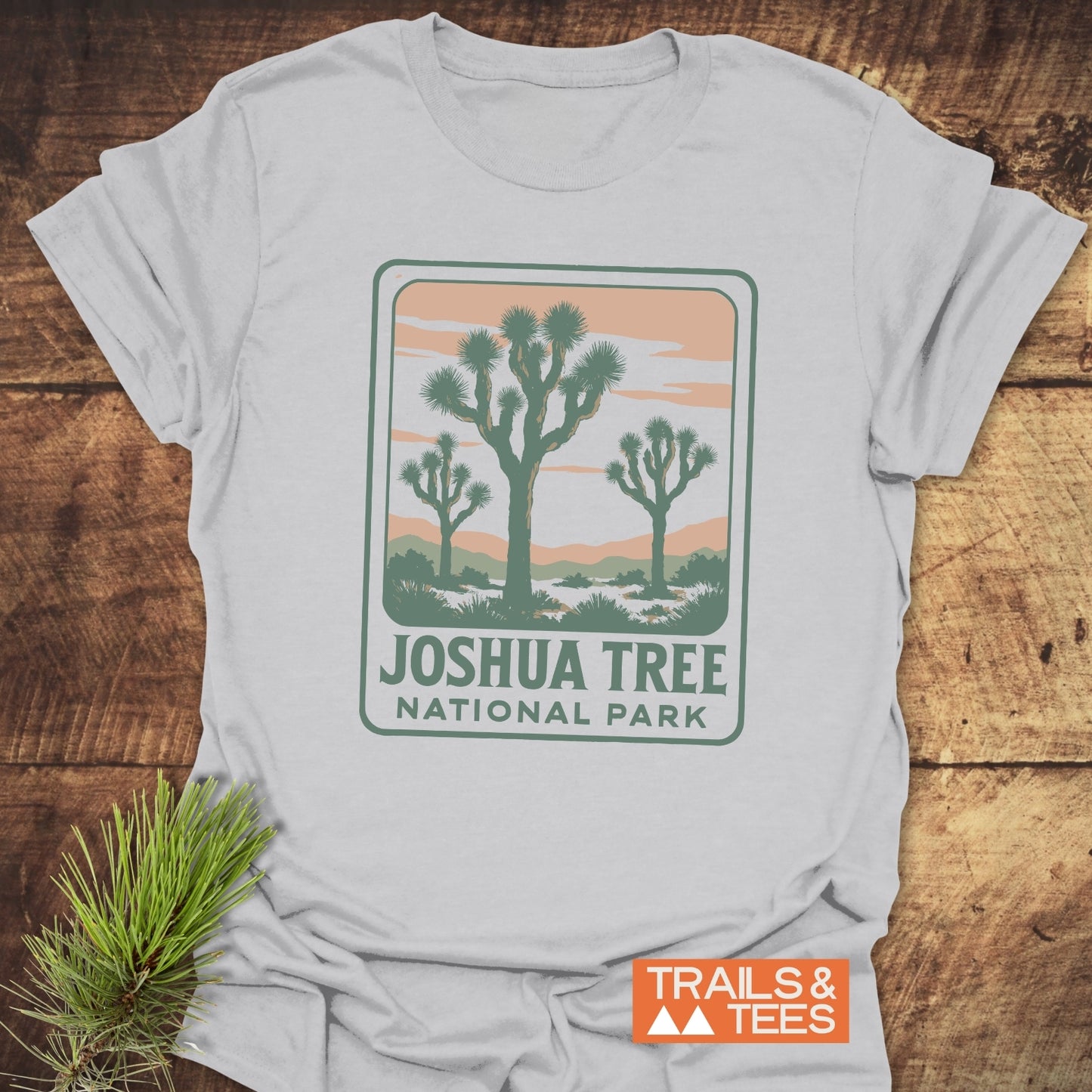 Vintage Joshua Tree NP T-Shirt with a retro desert graphic, highlighting Joshua trees and peachy hills. Comfort-driven design with durable, pre-shrunk cotton.