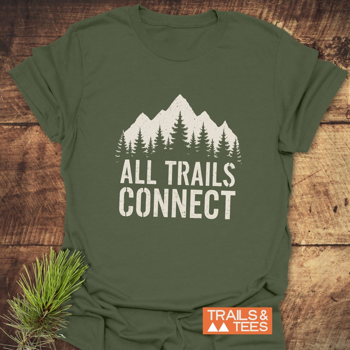 All Trails Connect T-Shirt featuring a mountain and pine design, crafted from soft ring-spun cotton with durable prints. Ideal for outdoor enthusiasts.