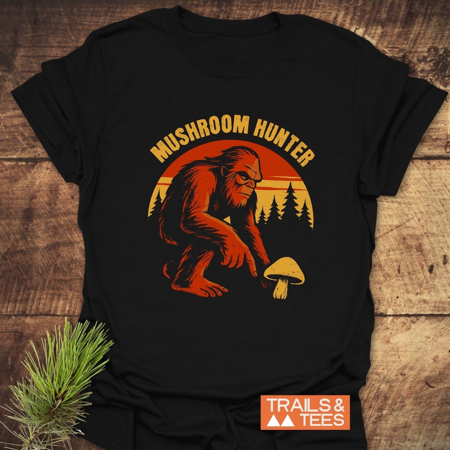 Mushroom Hunter T-Shirt with Sasquatch graphic, ring-spun cotton, featuring TRAILS & TEES logo, ideal for outdoor enthusiasts.