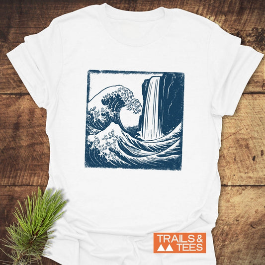 Waterfall And Wave T-Shirt featuring a blue wave-waterfall graphic. Made from soft cotton, it offers comfort and durability, ideal for outdoor enthusiasts.