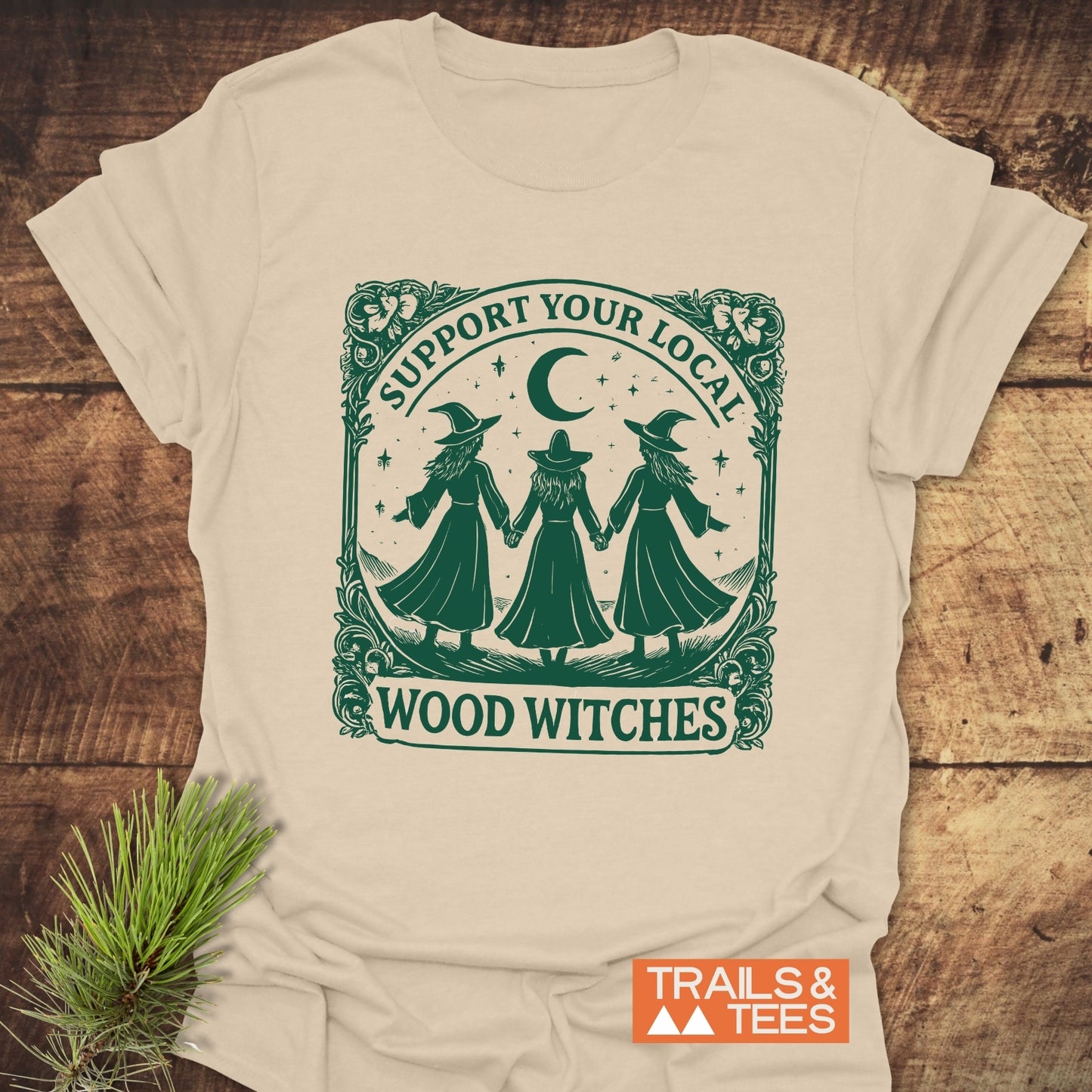 Copy of Take A Hike Human T-Shirt featuring three witches in a circle under a crescent moon, framed by SUPPORT YOUR LOCAL WOOD WITCHES slogan.