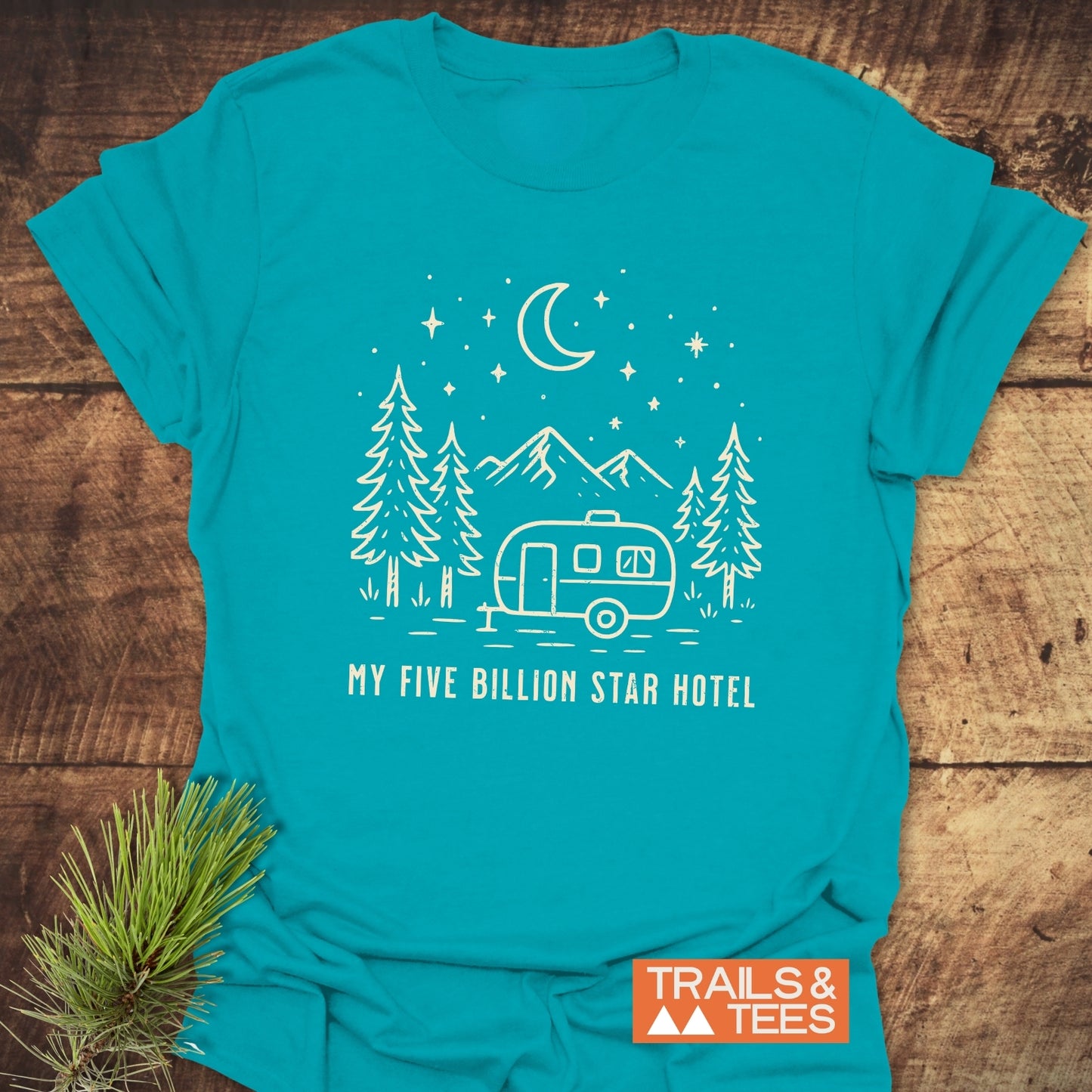 My 5 Billion Star Hotel T-Shirt displays a travel trailer design among pines and mountains, symbolizing outdoor adventure and comfort with soft, durable cotton.