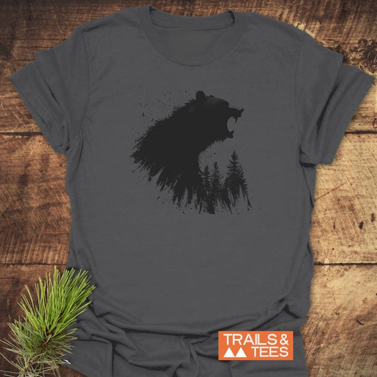 Roaring Bear Forest T-Shirt: Charcoal-gray tee with a bear silhouette merging into pine trees, on soft ring-spun cotton, offering trail-tested comfort and durability.