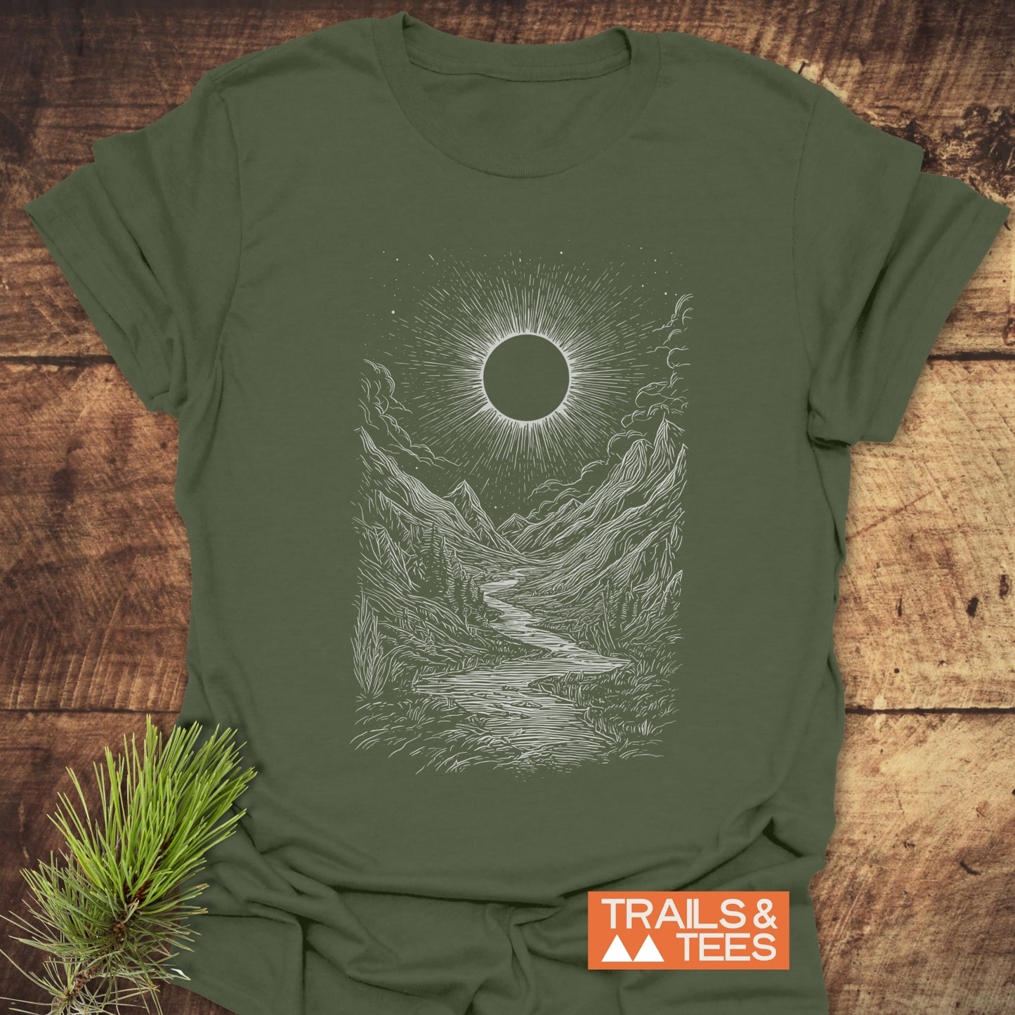 Eclipse Canyon T-Shirt featuring a mountain landscape print, crafted from soft cotton for comfort on adventures. Durable, pre-shrunk, and eco-friendly design by TRAILS & TEES.