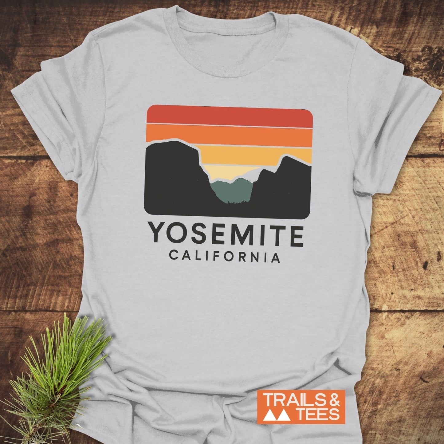 Retro Yosemite T-Shirt featuring a mountain design on light-gray cotton, highlighting YOSEMITE CALIFORNIA. Perfect for outdoor enthusiasts, showcasing durability and comfort.